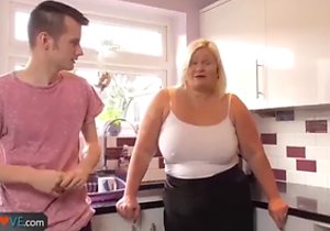 Blond-haired mom taking care of a huge boner
