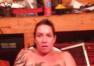 Tatted-up lady rubbing herself for the camera